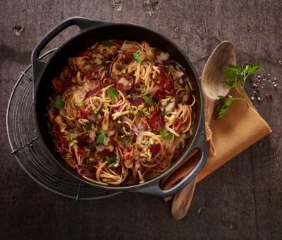 One-pot pasta dish with zucchini and spicy sausage