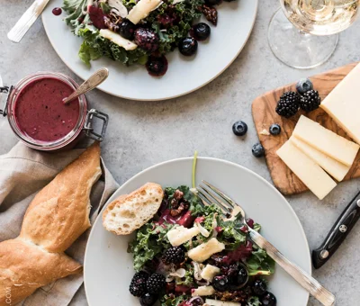 Blackberry and blueberry kale salad with Aged Havarti and berry dressing