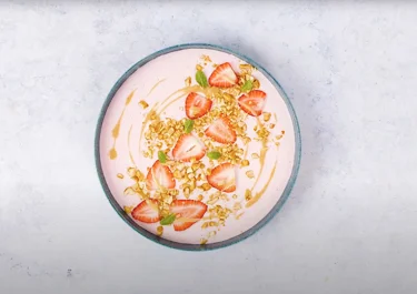 Lactose-free smoothie bowl with peanut butter and berries