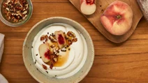 Skyr bowl with peach, pecan, and cardamom