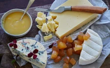 Cheese board with lemon curd and candied ginger