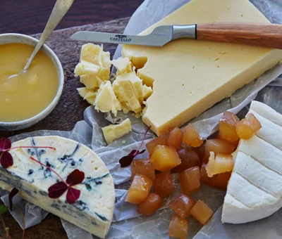 Cheese board with lemon curd and candied ginger