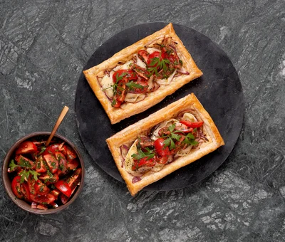 Onion tart with Castello Creamy White and fresh tomatoes