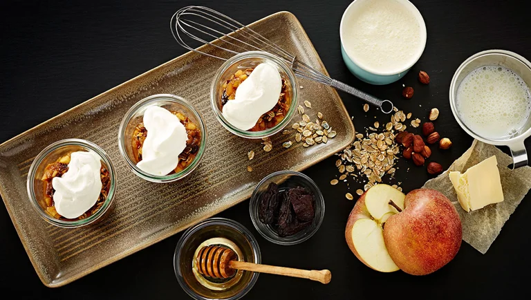 Apple-prune trifle with roasted rye flakes and whipped cream