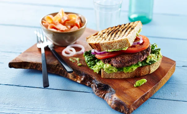 Beef sandwich with avocado cream and carrot salad