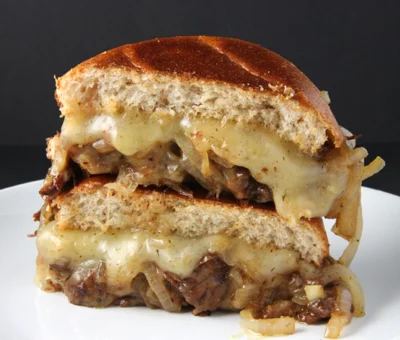 Slow cooked lamb burgers with Havarti and caramelized onions