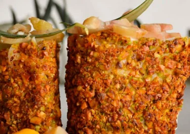 Merluza para Navidad en costra de pistachos