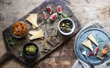 Cheese board with pesto and tomato tapenade