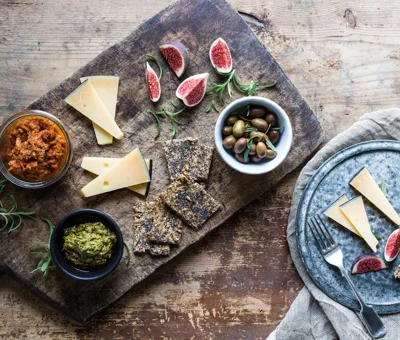 Cheese board with pesto and tomato tapenade