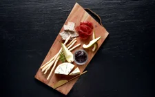 Castello® Creamy Blue with blackcurrant jam, pumpkin seeds, fresh pear and bresaola