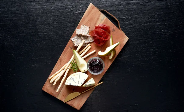 Castello® Creamy Blue with blackcurrant jam, pumpkin seeds, fresh pear and bresaola