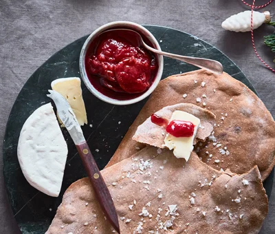 Giant crisp breads with plums and Double Cream Brie