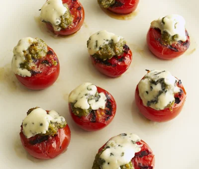Grilled tomatoes with Blue Cheese slices and basil pesto
