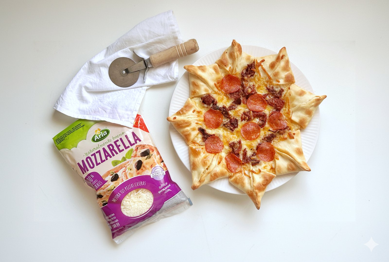 Pizza estrella con Arla Mozarella rallada