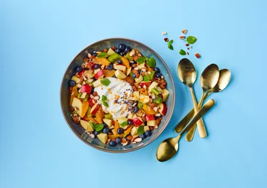 Fresh berry fruit salad with ginger and skyr