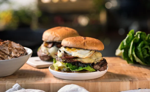 Rib-Eye Burger with fried egg, onions & cheddar