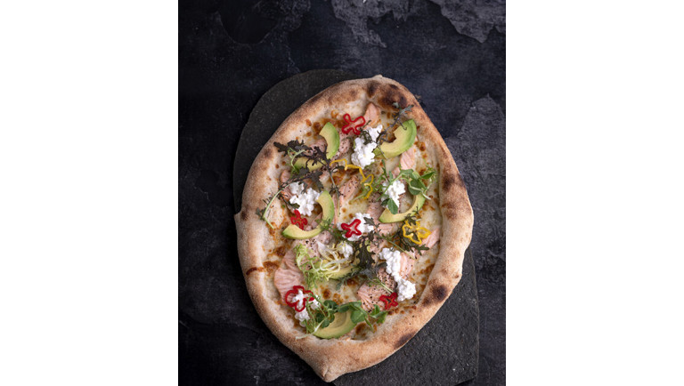 Pizza with salmon and avocado