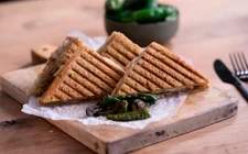 Toasted Serrano ham sandwich with Aged Havarti and Padrón peppers
