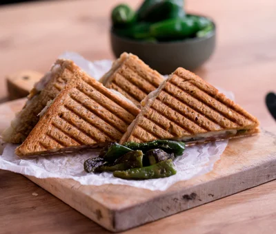 Toasted Serrano ham sandwich with Aged Havarti and Padrón peppers