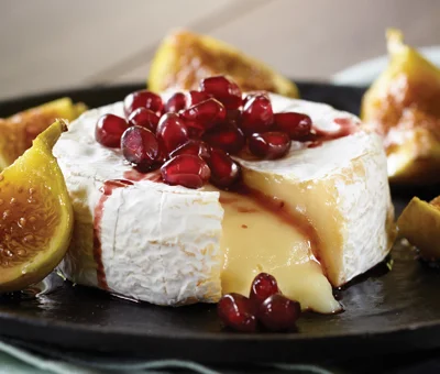 Baked Castello® Brie with Figs and Pomegranate Reduction