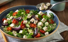 Pearl Couscous Salad with Roasted Tomatoes, Red Onions and Castello® Greek Style Cheese Cubes
