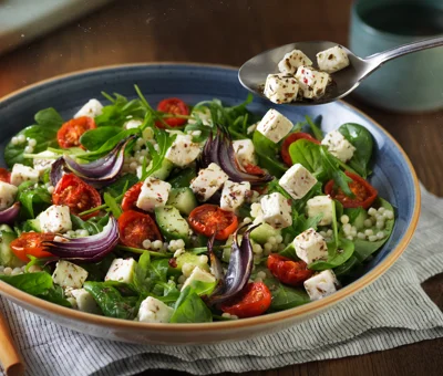 Pearl Couscous Salad with Roasted Tomatoes, Red Onions and Castello® Greek Style Cheese Cubes