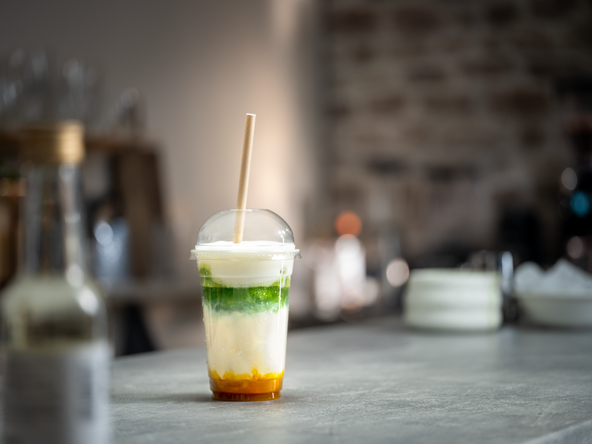 Mango-passionfruit iced matcha latte
