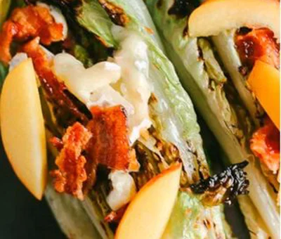 Grilled romaine, peach, bacon and Blue Brie salad