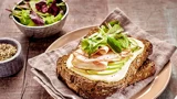 Open sandwich with cheese, turkey and apple slices