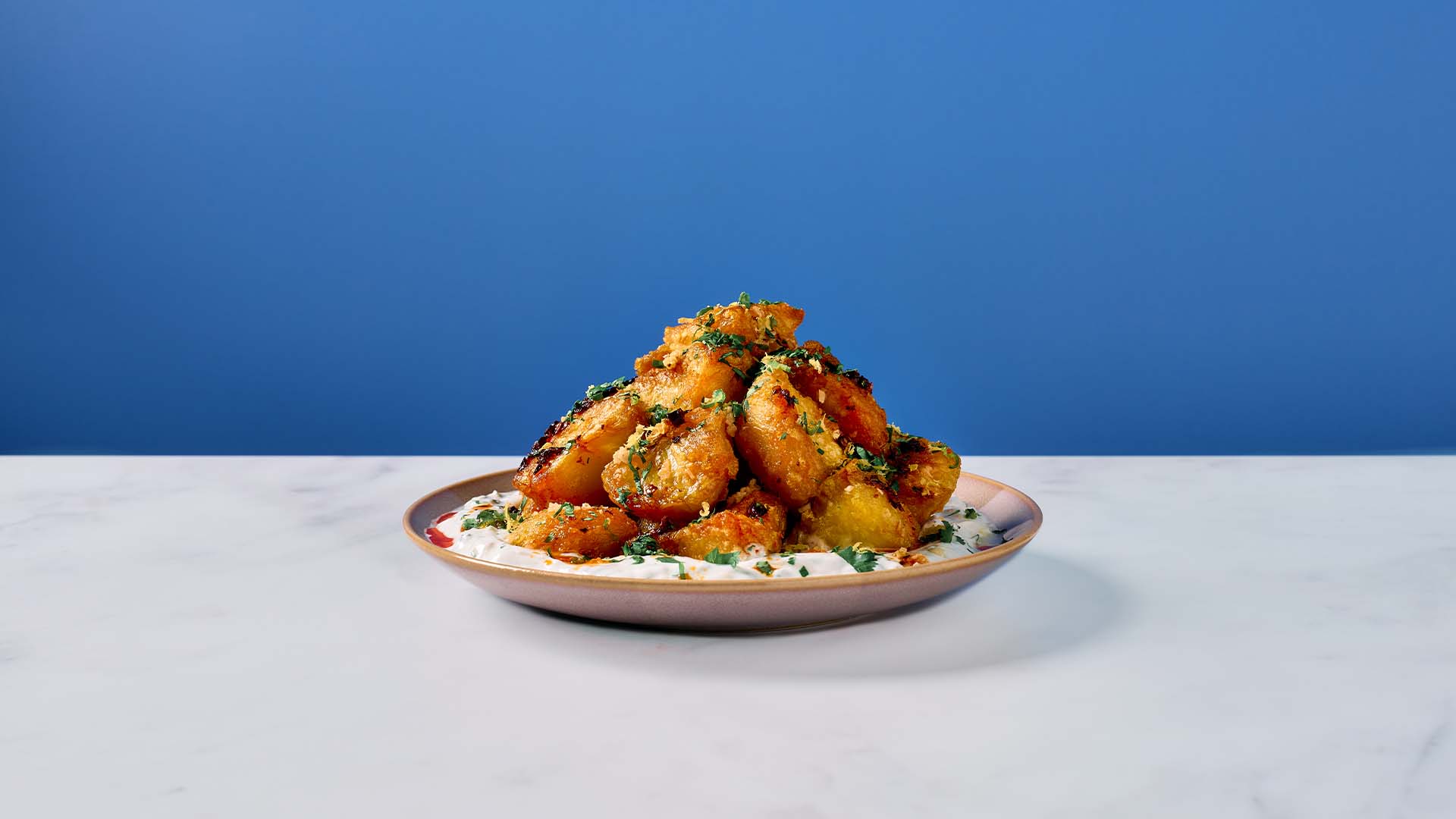 Lactose free chilli-garlic yogurt potatoes