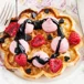 Waffles with whipped raspberry panna cotta and liquorice sauce