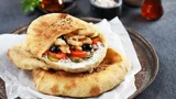 Arabic bread with cream cheese, chicken strips and vegetables
