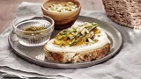 Toast with cheese, grilled vegetables, zaatar and pine nuts