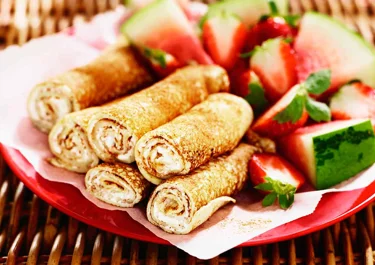 Pancake rolls with cream cheese and honey