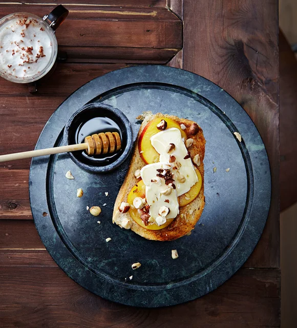 Open breakfast sandwich with Castello Extra Creamy Brie, fresh apricots and hazelnuts