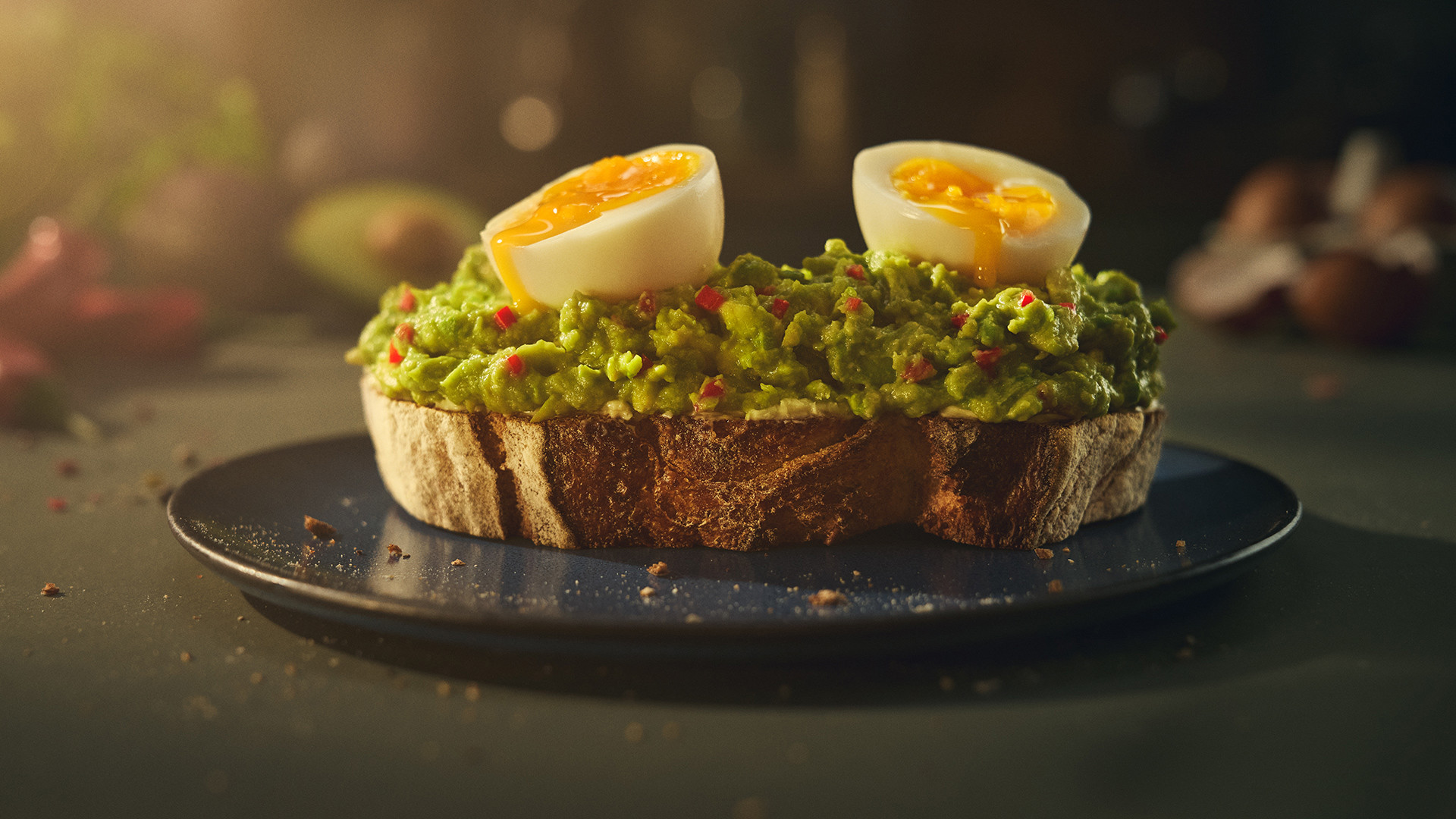 Smashed avocado on toast with boiled eggs