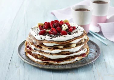 Pancake cake with chocolate and cream