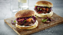 Duck burger with red cabbage salad and blue cheese dressing 