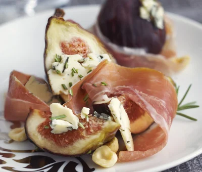 Grilled prosciutto wrapped figs stuffed with Blue Cheese