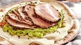 Arabic bread with cheese, guacamole, roast beef or pastrami and rocket salad