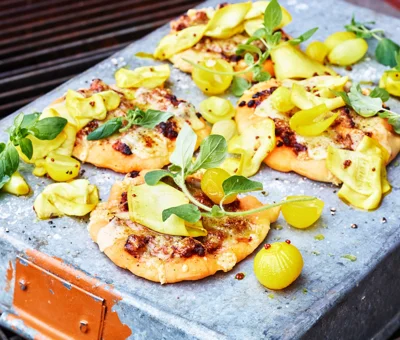 Lamb pizza with Cheddar Cheese topped with pickled onions and courgette