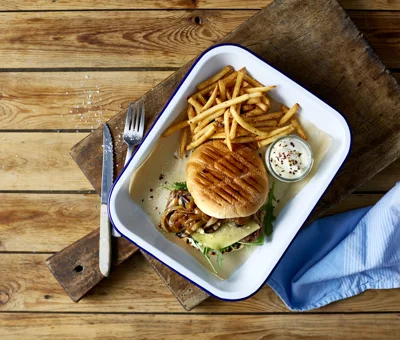 Cheddar steak burger with caramelised onions and portobello mushrooms