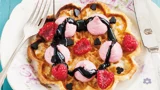 Waffles with whipped raspberry panna cotta and liquorice sauce