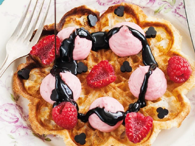 Waffles with whipped raspberry panna cotta and liquorice sauce