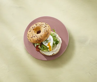 Bagel with Castello® pepper whipped cream cheese, bacon, egg, and avocado