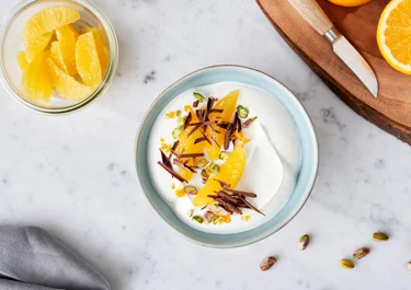 Skyr bowl with orange, chocolate, and pistachio