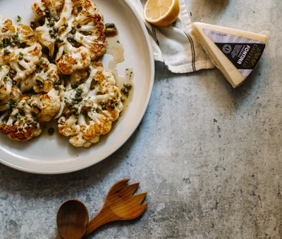 Cheesy Cauliflower “Steaks” with Warm Caper Vinaigrette