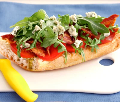 BLT salad on toasted baguette with blue cheese